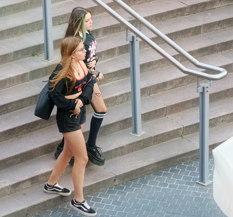 14 - Two girls walking down a set of concrete steps
